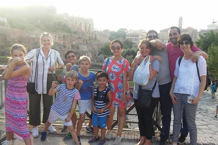 Visitors standing at a Roman Forum viewpoint