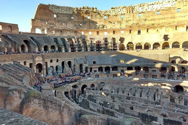 Sunlit Colosseum interior seen from the main visitor levels