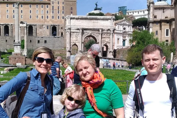 Visitors beside the Arch of Septimius Severus in the Roman Forum