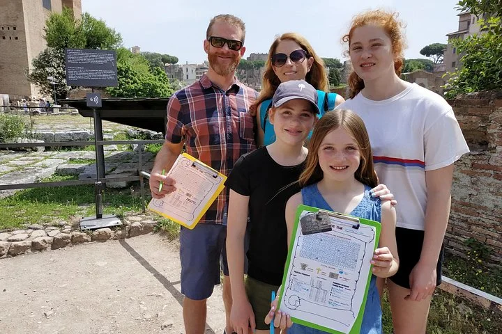 Children holding activity sheets on a Roman Forum path