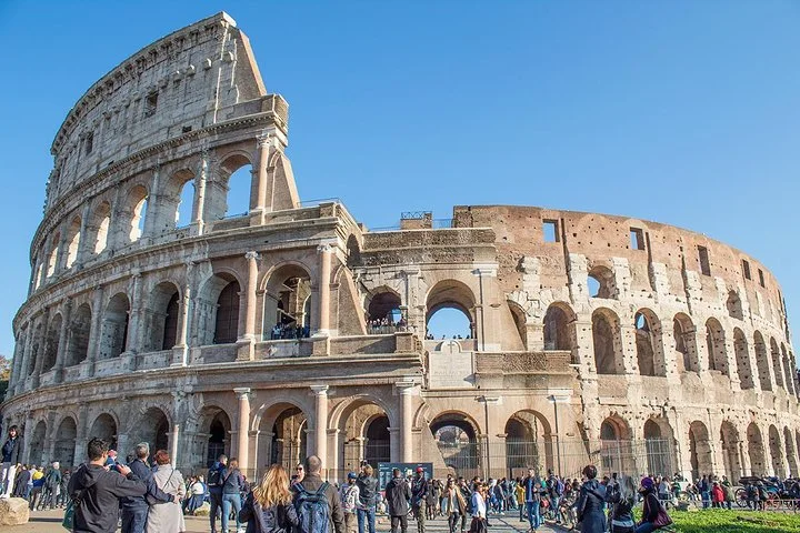 Colosseum exterior beneath a clear blue sky