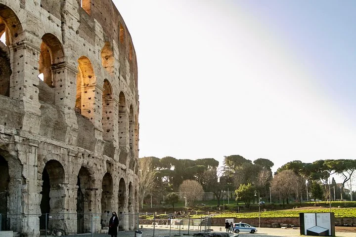Warm evening light on the Colosseum exterior arches
