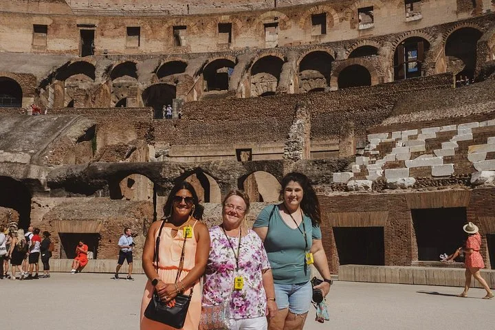 Visitors standing on the Colosseum arena platform