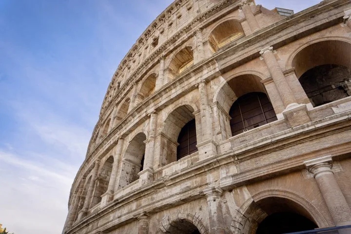 Upward view of the Colosseum exterior arches