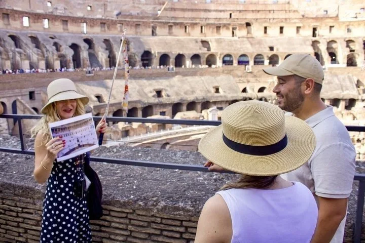 Guide showing an illustrated sheet at a main-level Colosseum railing