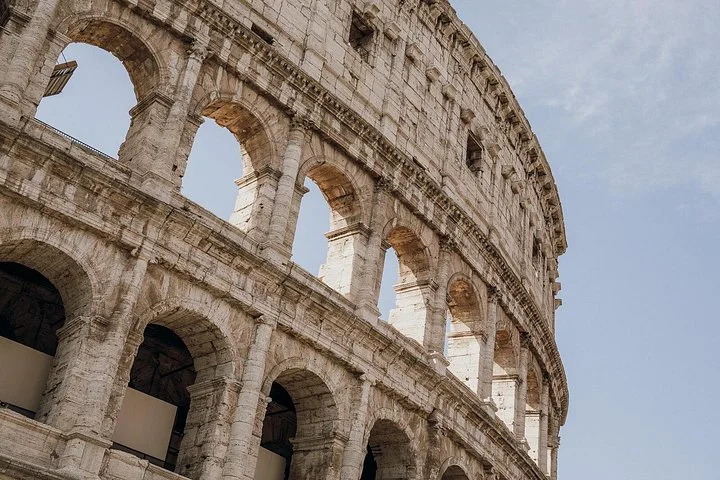 Close upward view of Colosseum exterior arches