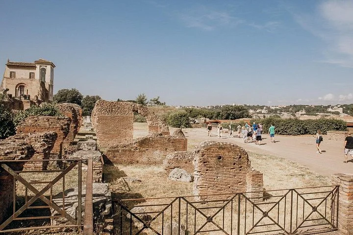 Sunlit brick ruins and open paths on Palatine Hill