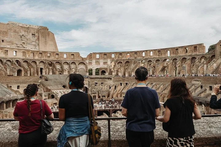 Visitors overlook the Colosseum's ancient interior.