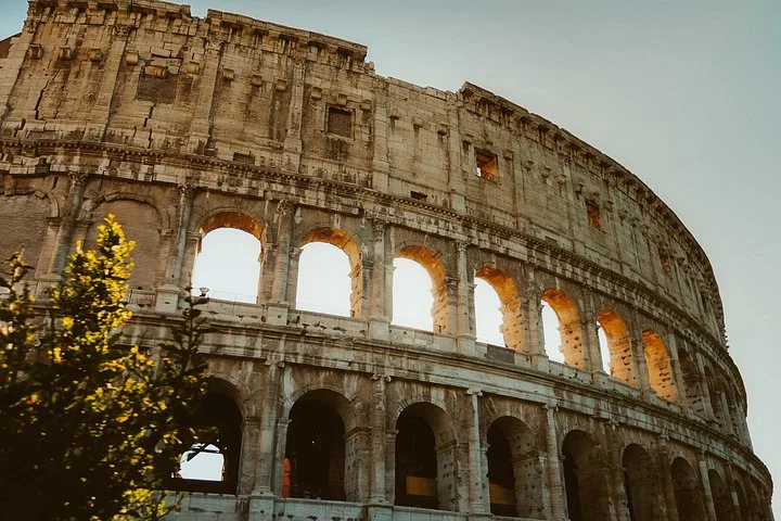 Warm light on a close view of the Colosseum facade