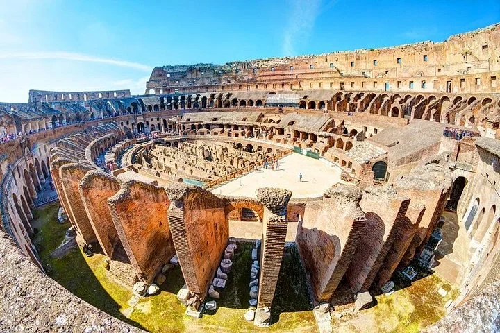 A wide-angle view reveals the Colosseum's arena and ancient seating structures.