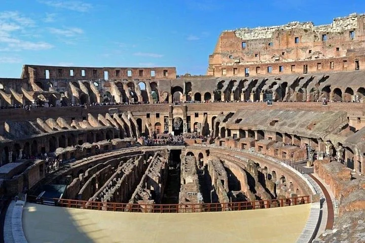 The Colosseum arena and hypogeum are seen from an elevated visitor level.