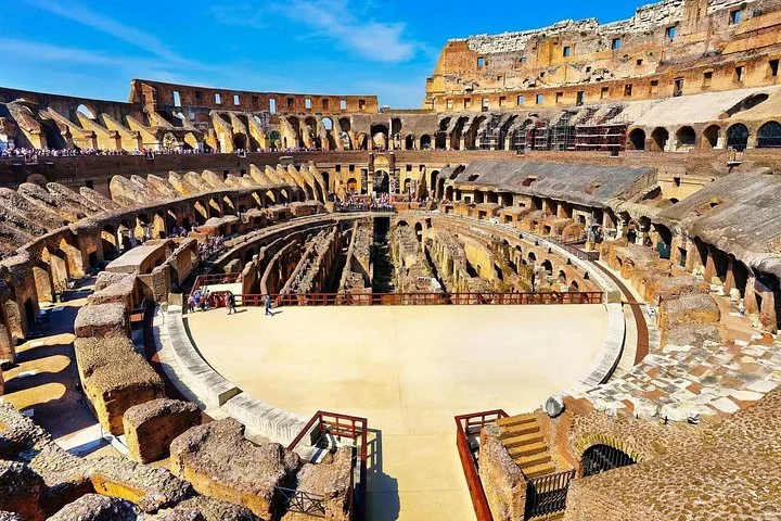 Sunlit arena platform and hypogeum viewed from the main Colosseum levels