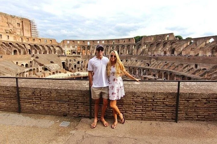 Two visitors at the main Colosseum overlook
