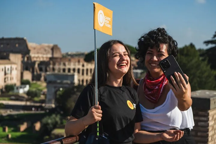 Guide and visitor taking a photograph above the Roman Forum