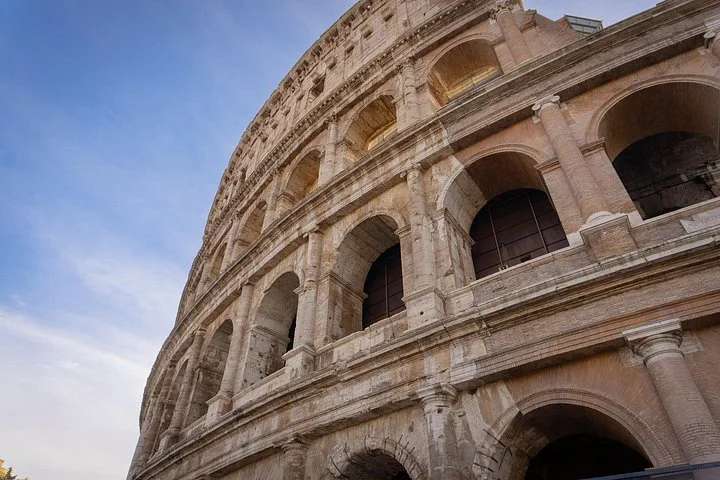 Close upward view of the Colosseum exterior arches