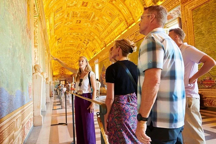 Guide explaining a map fresco in the Vatican Museums