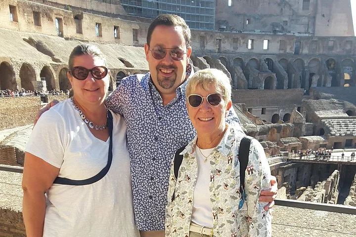 Three visitors at the main Colosseum overlook