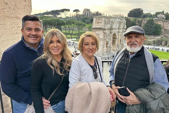 Visitors at an overlook above the archaeological area beside the Colosseum