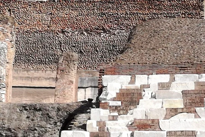 Surviving marble seating and brickwork inside the Colosseum