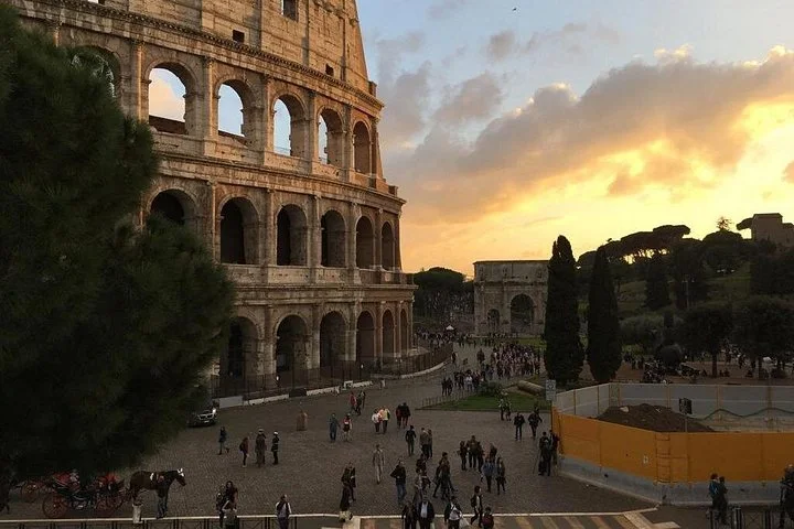 Colosseum exterior and public square at sunset