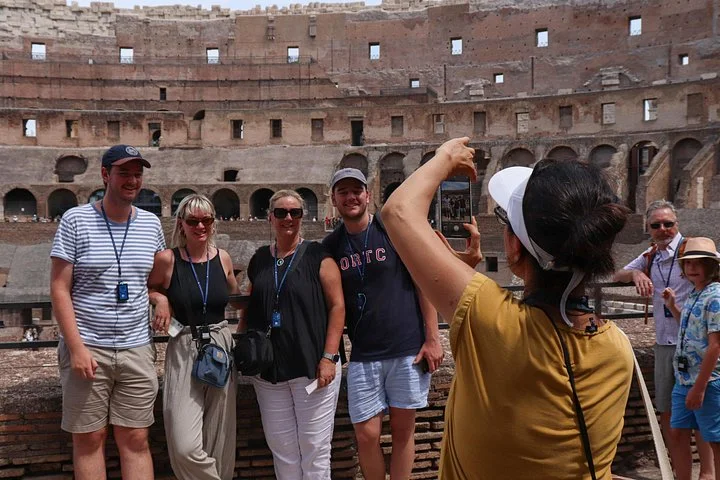 Visitors taking photographs at the main Colosseum overlook