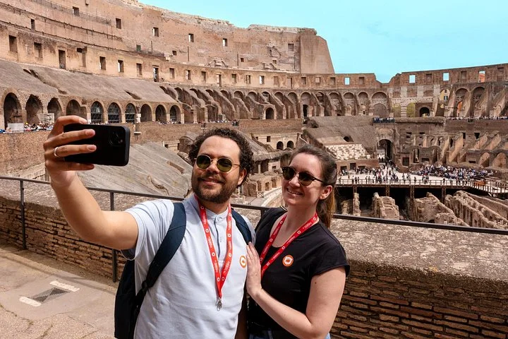 Two visitors taking a selfie at the main Colosseum overlook