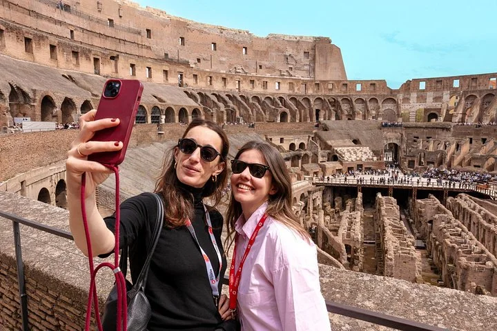 Two visitors taking a selfie at the main Colosseum overlook