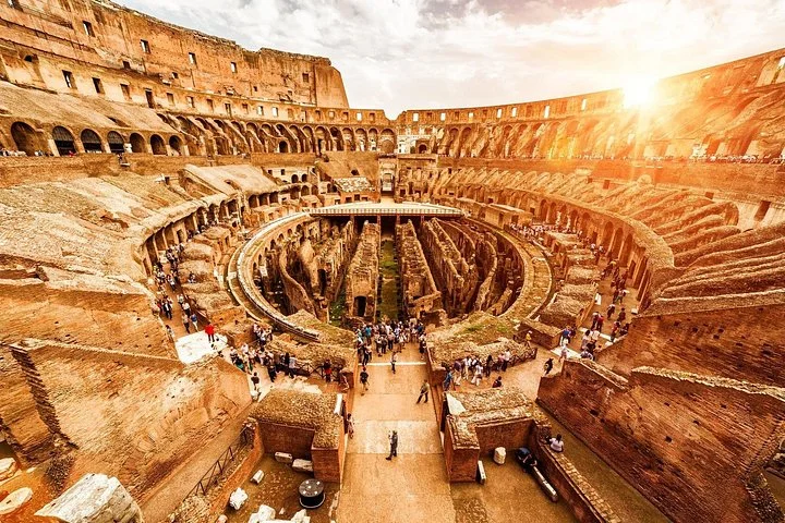 Wide-angle Colosseum interior in warm sunlight