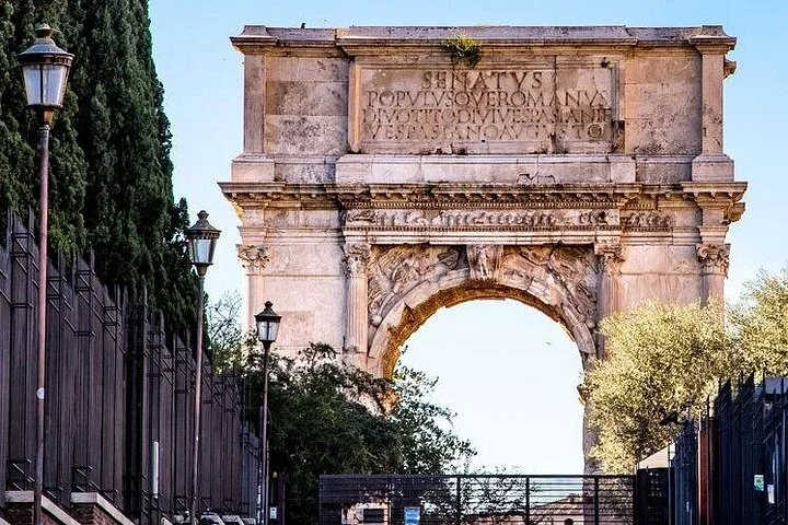 Arch of Titus framed by trees