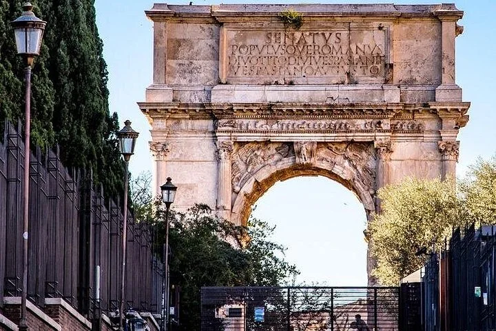 Arch of Titus framed by trees