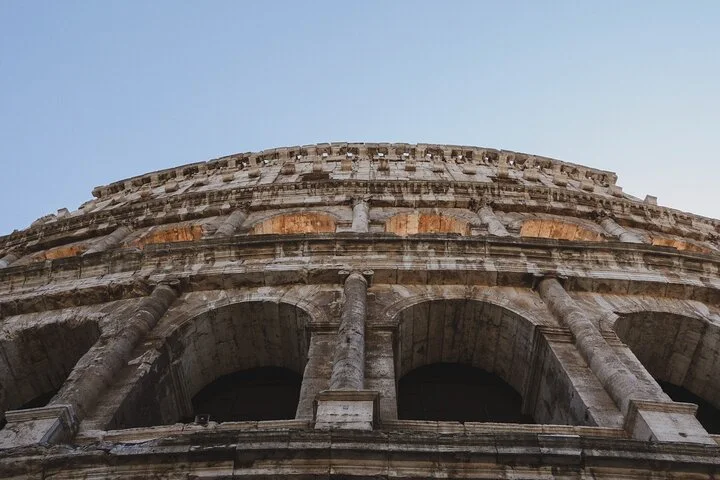Upward view of the Colosseum facade