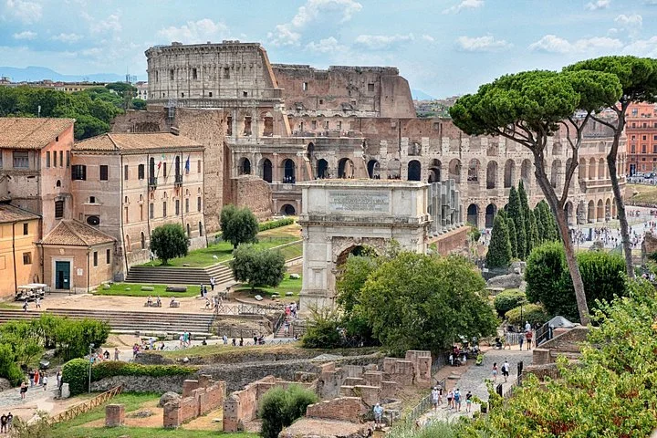 Colosseum and Arch of Titus beyond Roman Forum paths