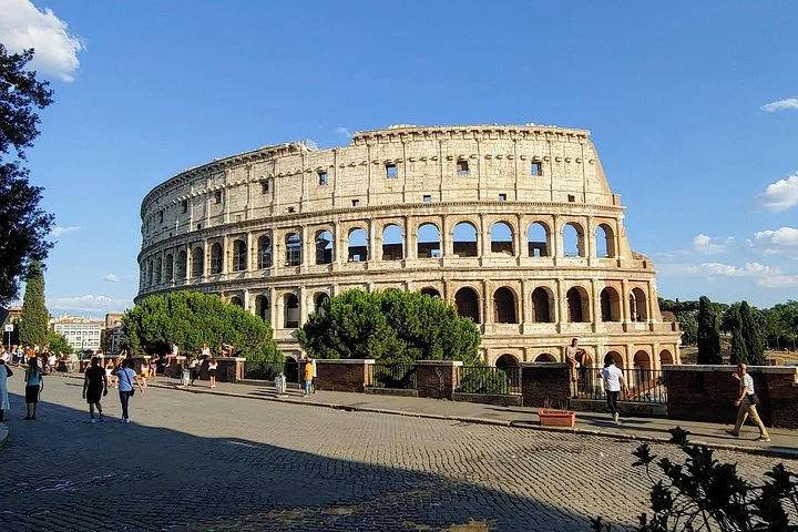 Colosseum exterior beside a cobbled public square