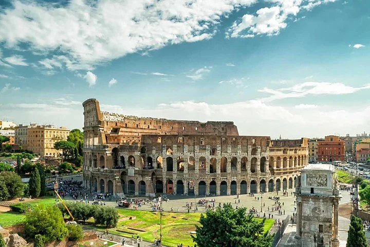 Colosseum exterior and green archaeological surroundings