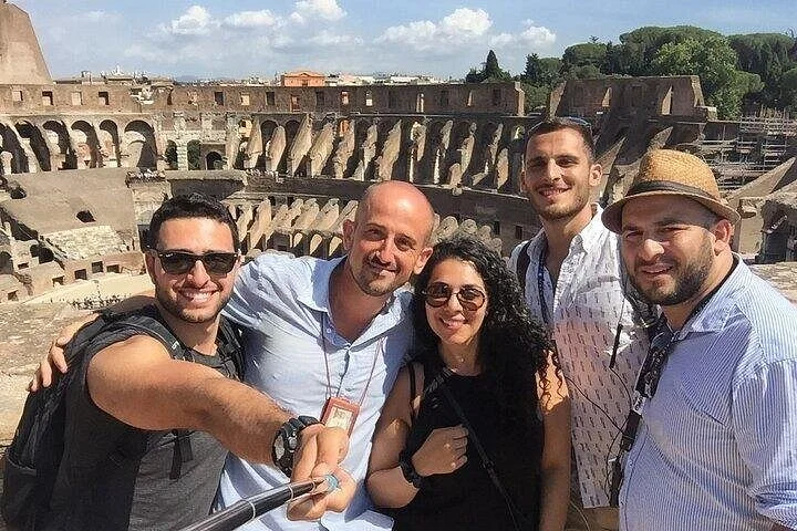 Visitors taking a selfie at a Colosseum main-level overlook