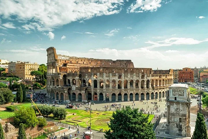 Colosseum exterior and green archaeological surroundings