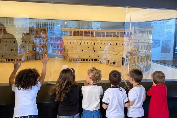 Children viewing a scale model of the Colosseum in the museum