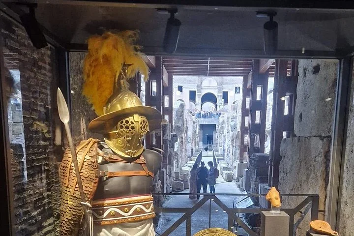 An armour reconstruction is displayed beneath the Colosseum arena.