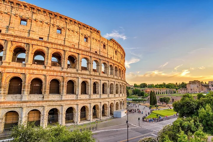 Golden evening light across the Colosseum exterior