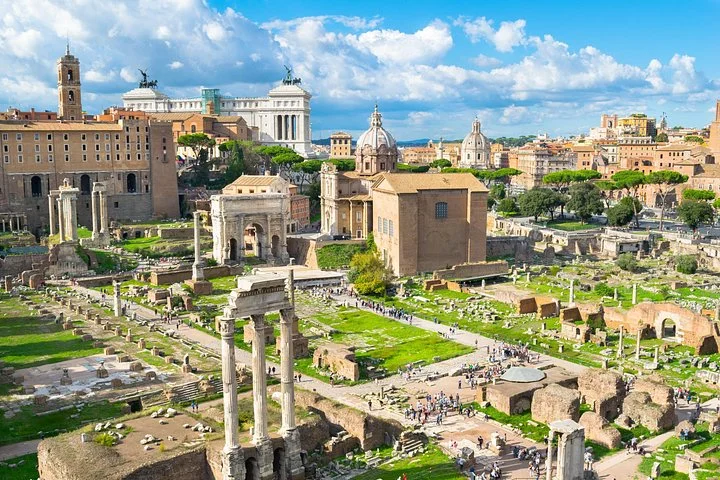 Wide Roman Forum panorama beneath a bright blue sky