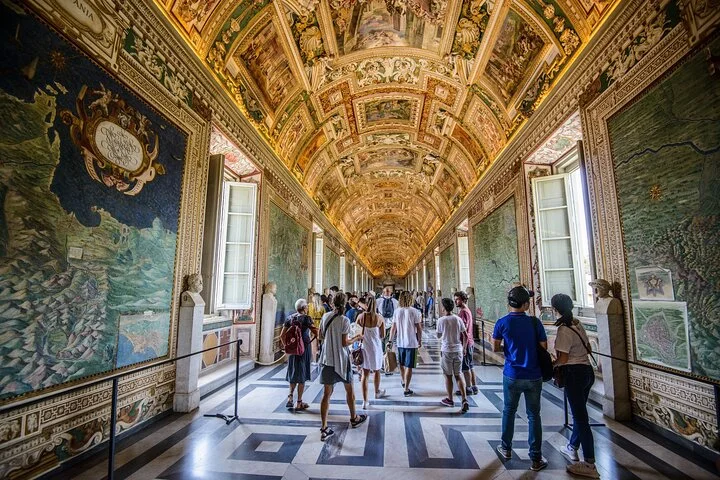 Visitors walking through the Vatican Gallery of Maps
