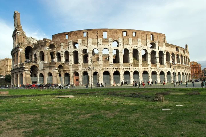 Colosseum exterior above a green lawn