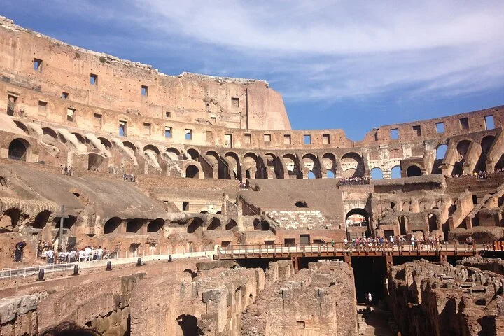 Ancient stone chambers sit beneath the Colosseum arena platform.