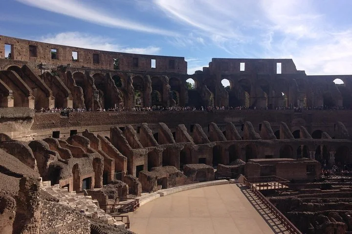 The Colosseum arena platform sits below its ancient tiers.