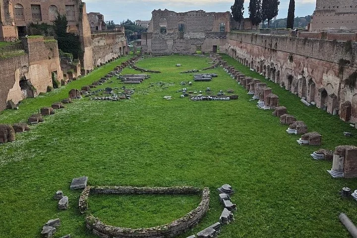 Green grass fills the ancient stadium-shaped garden on Palatine Hill.