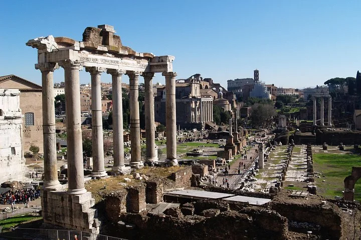 Temple columns and Roman Forum ruins under clear sky