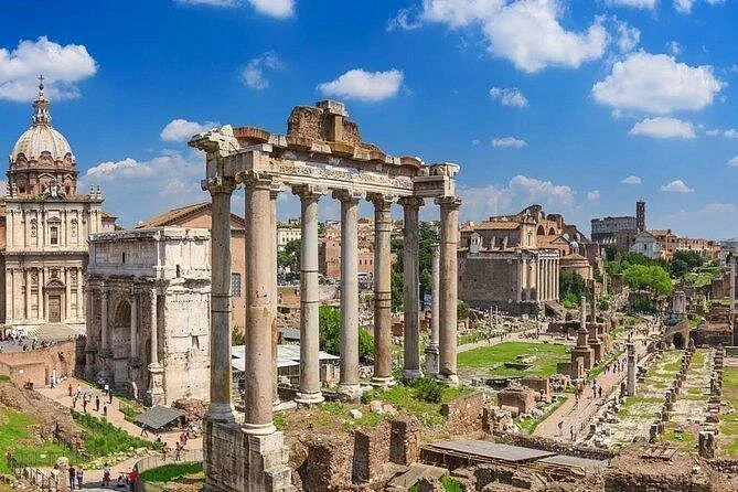 Temple columns and the Roman Forum beneath a bright sky