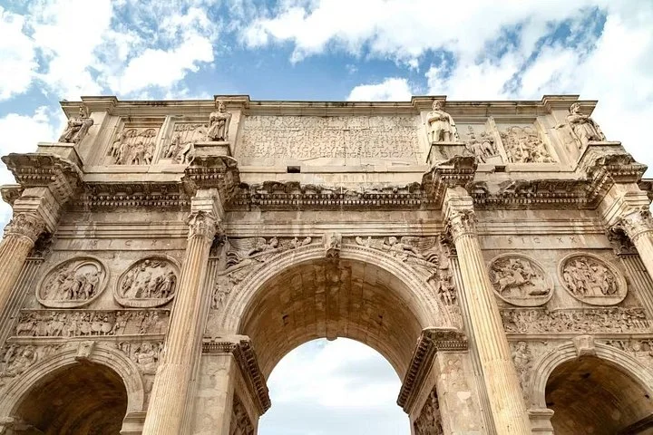 Upward view of the Arch of Constantine beside the Colosseum