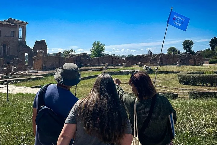 Visitors walking past ancient ruins on Palatine Hill