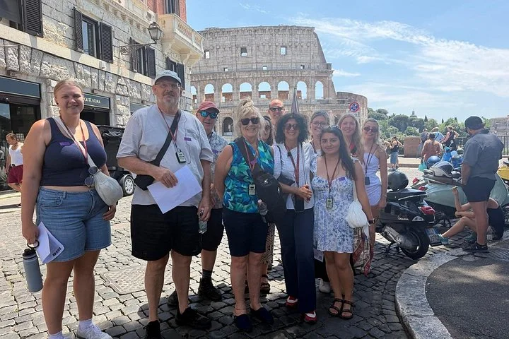 Visitors on a street beside the Colosseum